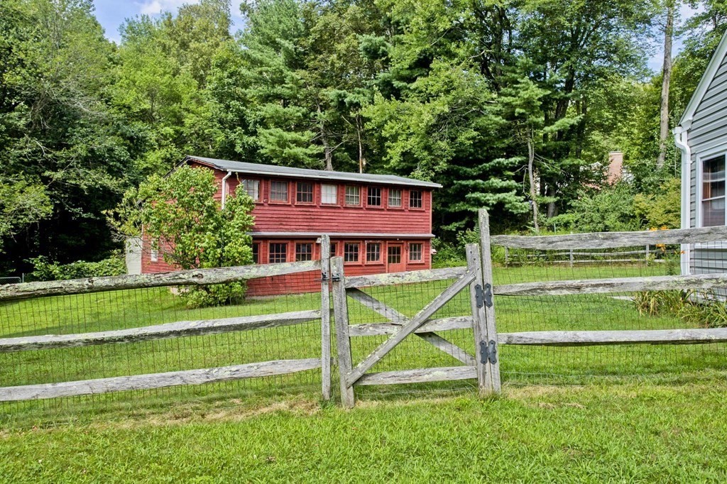 153 Bennett Road Hampden, MA 01036 - Photo 5 of 30 a view of a house with a big yard and a large trees