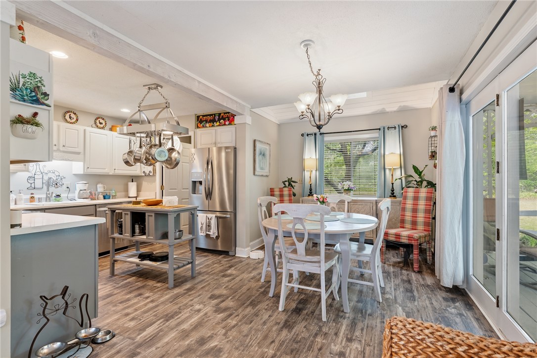 1412 Forest Lane Anderson, SC 29621 - Photo 6 of 31 This bright kitchen and dining area offers comfortable living with outdoor access.