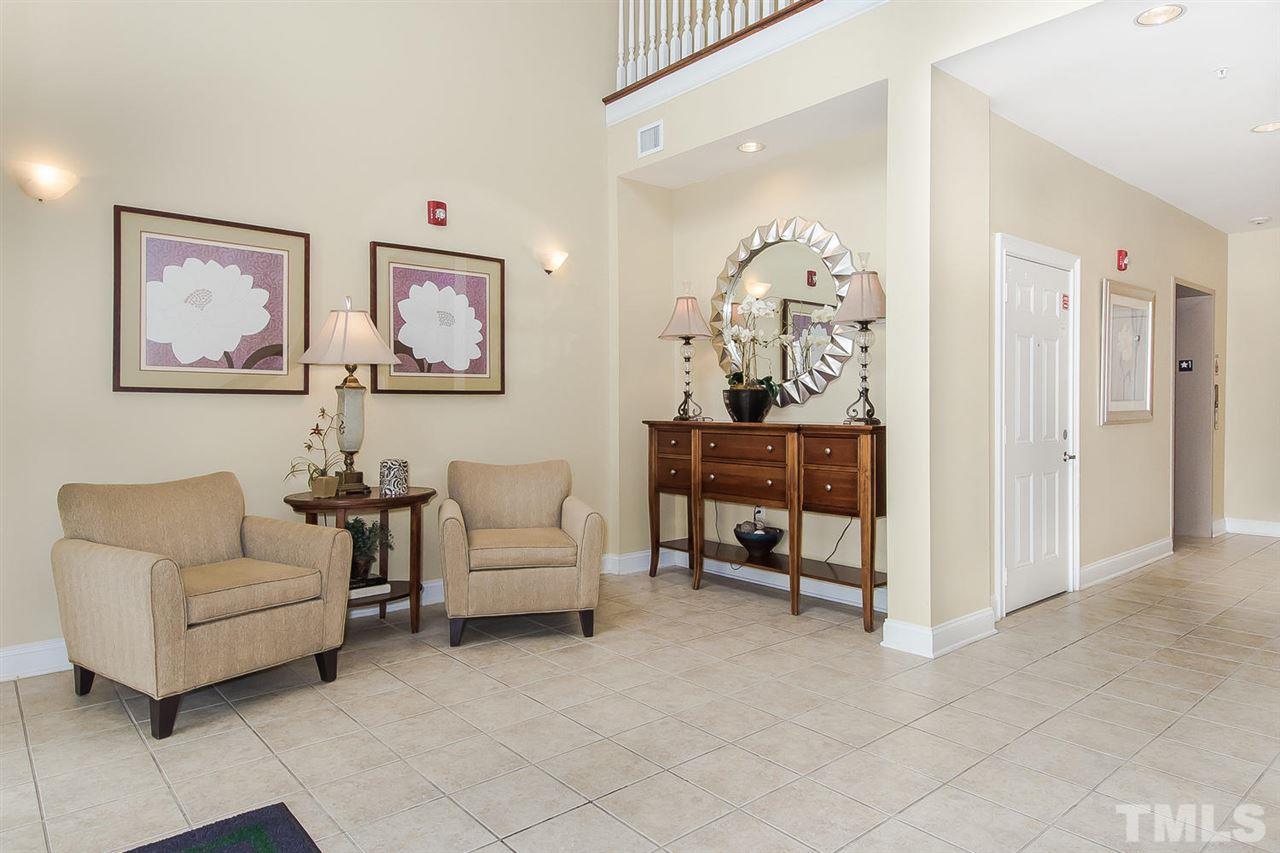 3811 Lunceston Way, Unit 301 Raleigh, NC 27613 - Photo 2 of 8 a view of living room filled with furniture and window