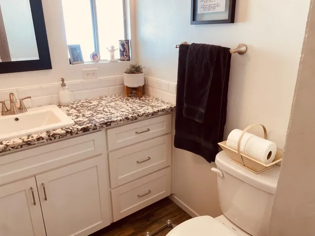 a bathroom with a sink and mirror