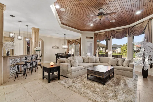 a large bathroom with a granite countertop sink large mirror and shower