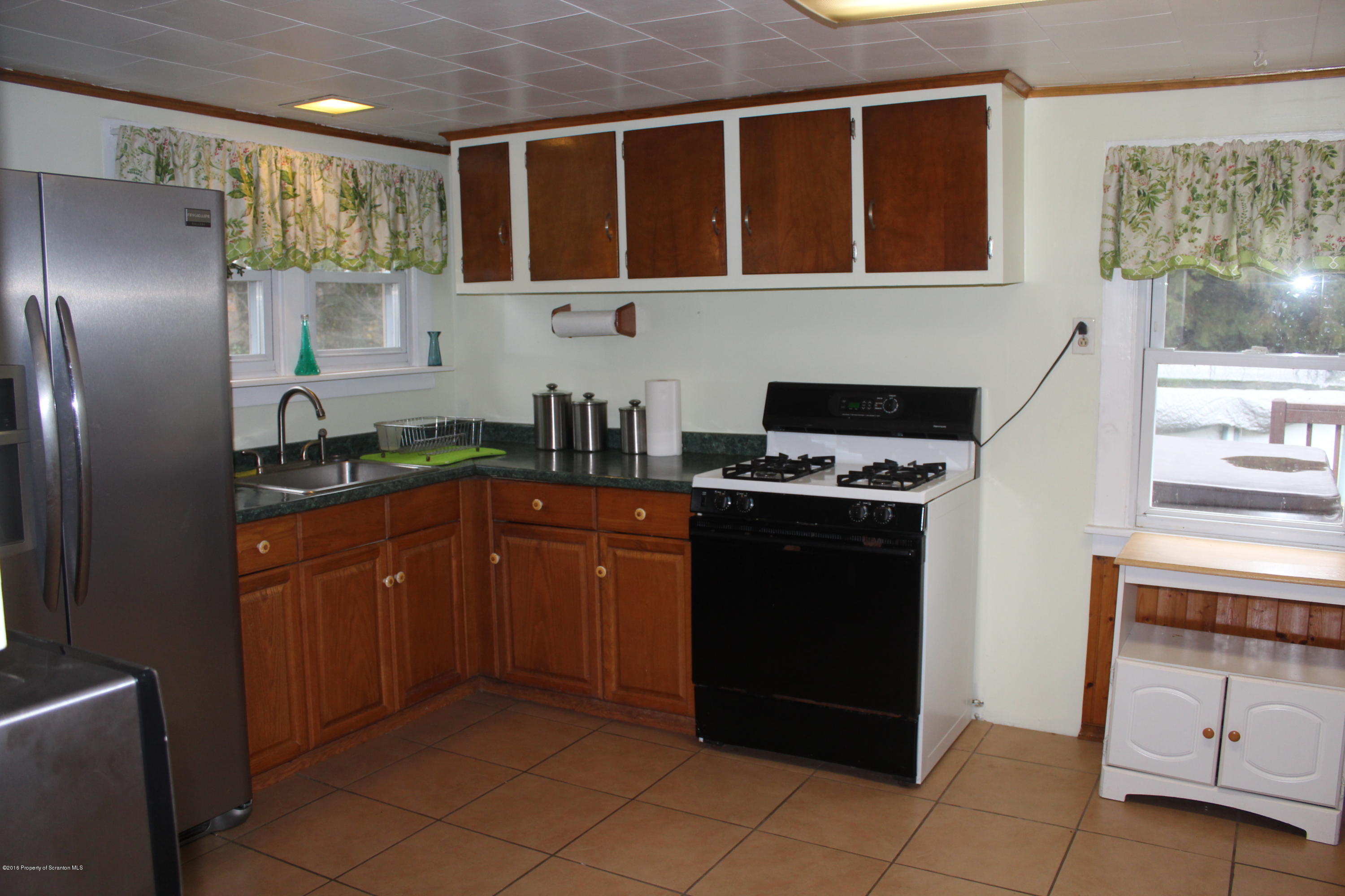 515 State Rte 2023 Forest City, PA 18421 - Photo 5 of 40 a kitchen with stainless steel appliances granite countertop a refrigerator and a stove