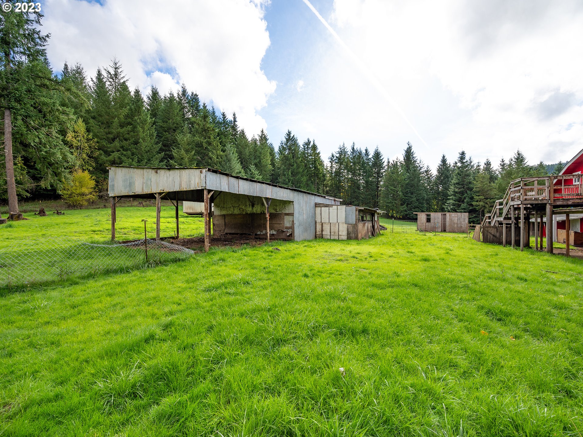 1590 Romie Howard Road Yoncalla, OR 97499 - Photo 42 of 48 a view of a house with backyard and a sitting area
