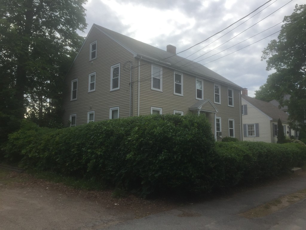 12 Saunders Road Norwood, MA 02062 - Photo 3 of 3 a front view of a house with a garden