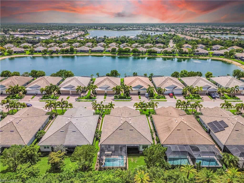 14695 Edgewater Circle Naples, FL 34114 - Photo 29 of 39 an aerial view of a house with a lake view