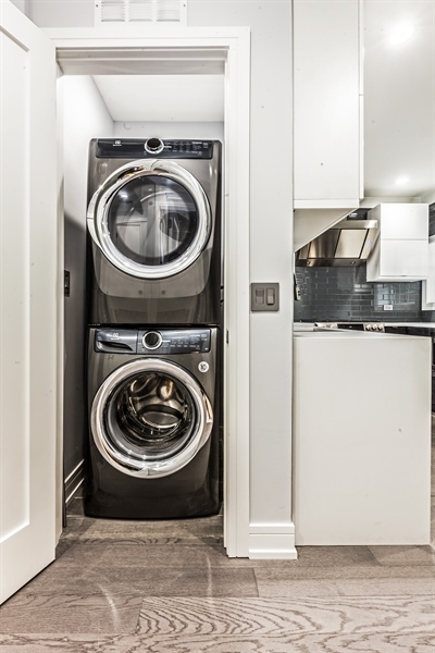 2141 West Fletcher Street, Unit 3F Chicago, IL 60618 - Photo 11 of 11 a view of a washer and dryer in a utility room