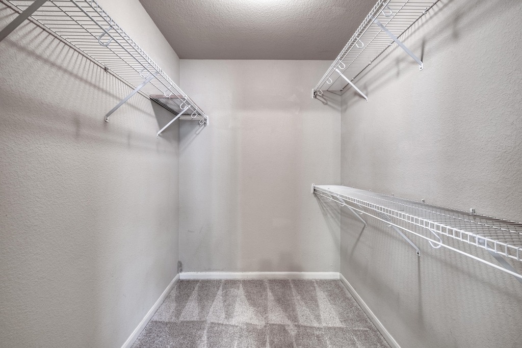 1303 Ridgewood Drive Leander, TX 78641 - Photo 14 of 28 a view of a room with racks on the wall