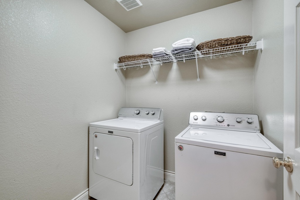 1303 Ridgewood Drive Leander, TX 78641 - Photo 20 of 28 a utility room with dryer and washer
