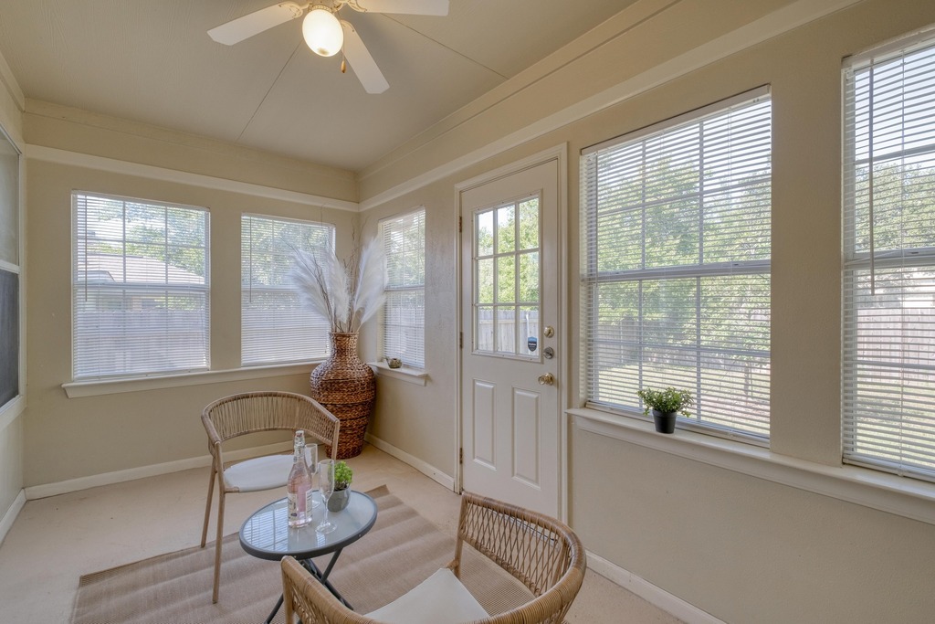 1303 Ridgewood Drive Leander, TX 78641 - Photo 21 of 28 a living room with furniture and floor to ceiling windows