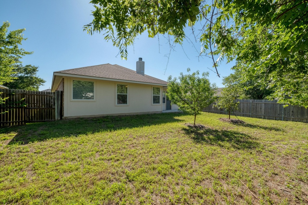 1303 Ridgewood Drive Leander, TX 78641 - Photo 23 of 28 a view of a house with a yard