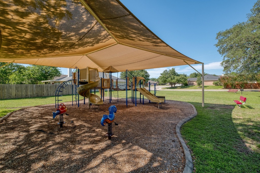1303 Ridgewood Drive Leander, TX 78641 - Photo 26 of 28 a view of a child park