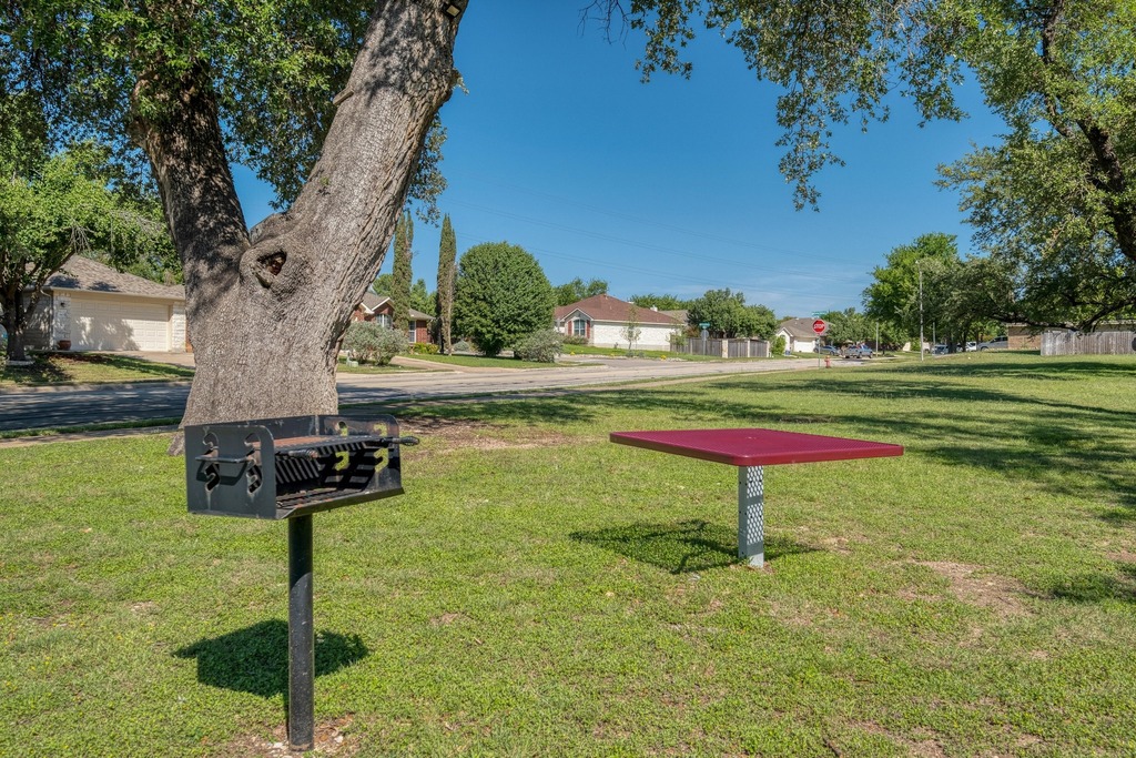 1303 Ridgewood Drive Leander, TX 78641 - Photo 28 of 28 a park with lots of trees and plants