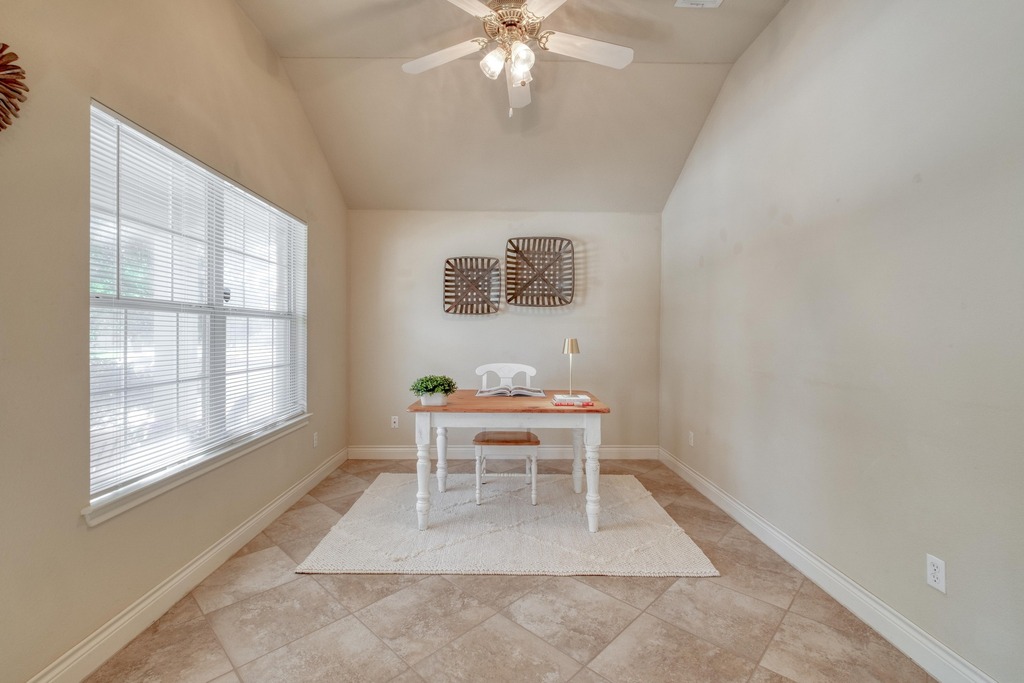 1303 Ridgewood Drive Leander, TX 78641 - Photo 3 of 28 a living room with a window and a table