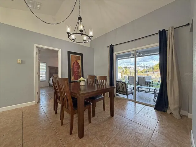 a kitchen with stainless steel appliances granite countertop a refrigerator a oven a sink and a oven