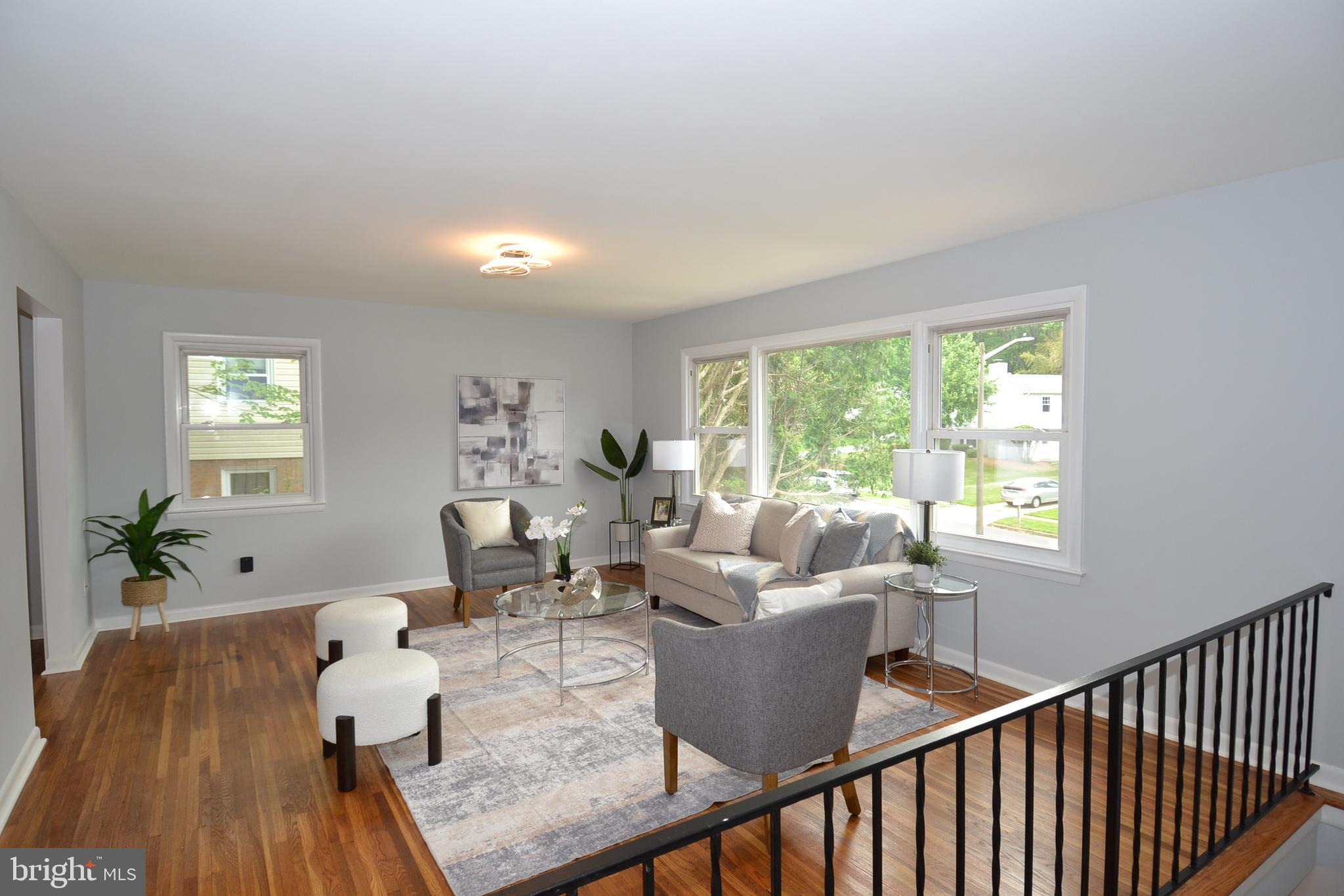 7103 Galgate Drive Springfield, VA 22152 - Photo 12 of 47 a living room with furniture and wooden floor