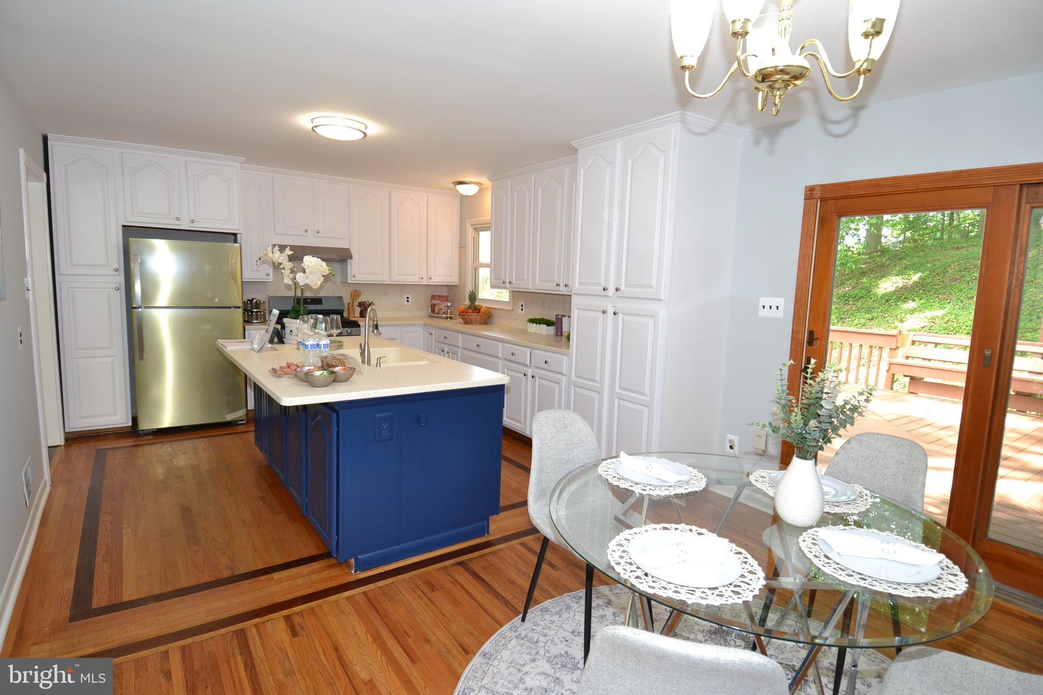 7103 Galgate Drive Springfield, VA 22152 - Photo 14 of 47 a view of a dining room with furniture window and outside view