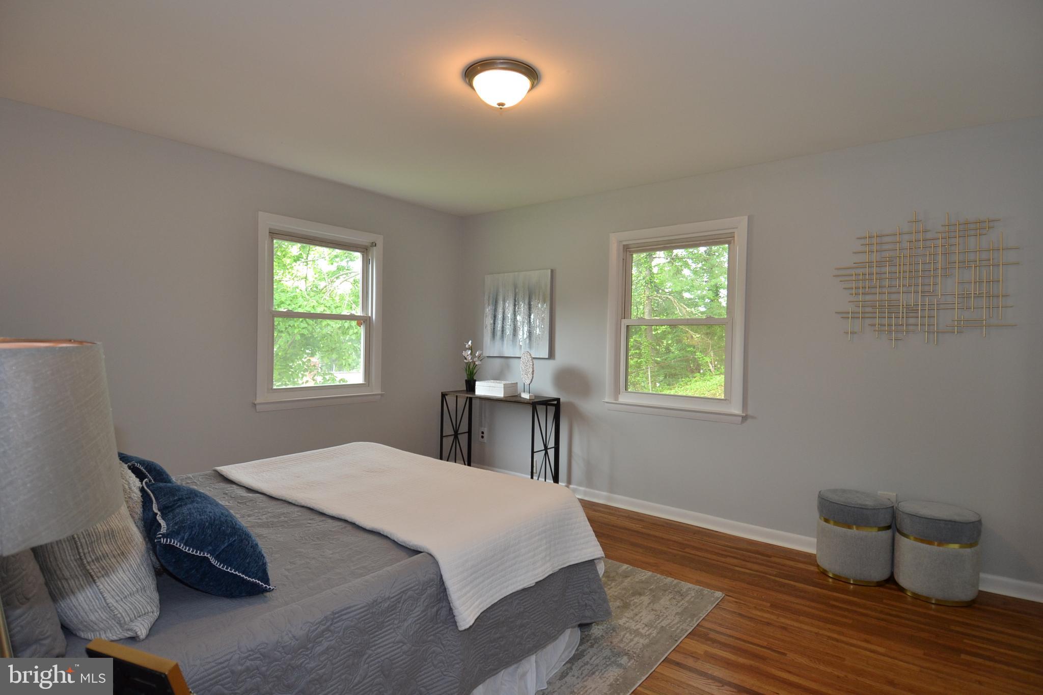 7103 Galgate Drive Springfield, VA 22152 - Photo 19 of 47 a bedroom with a bed and a window