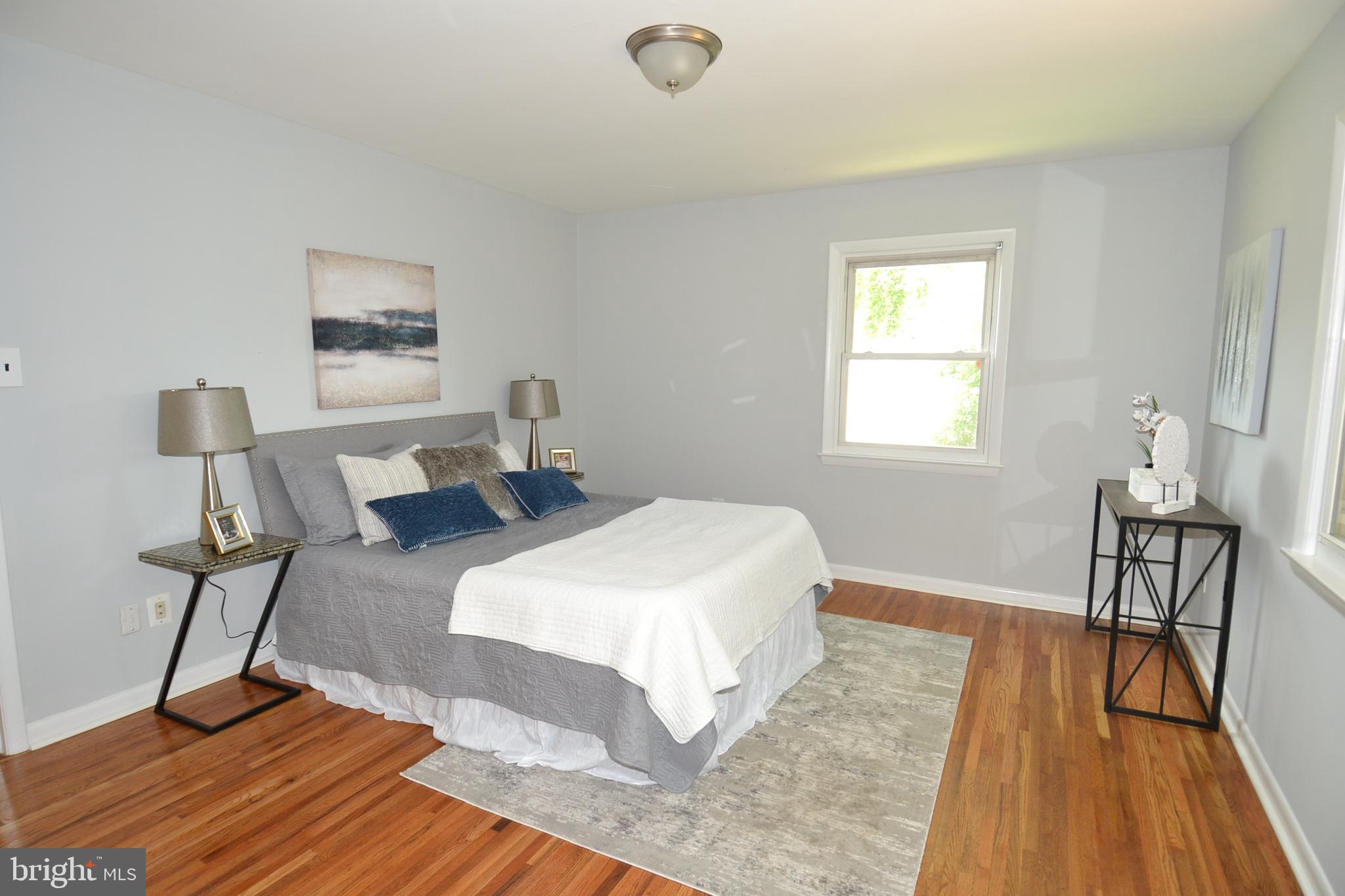 7103 Galgate Drive Springfield, VA 22152 - Photo 21 of 47 a bedroom with a bed and a table