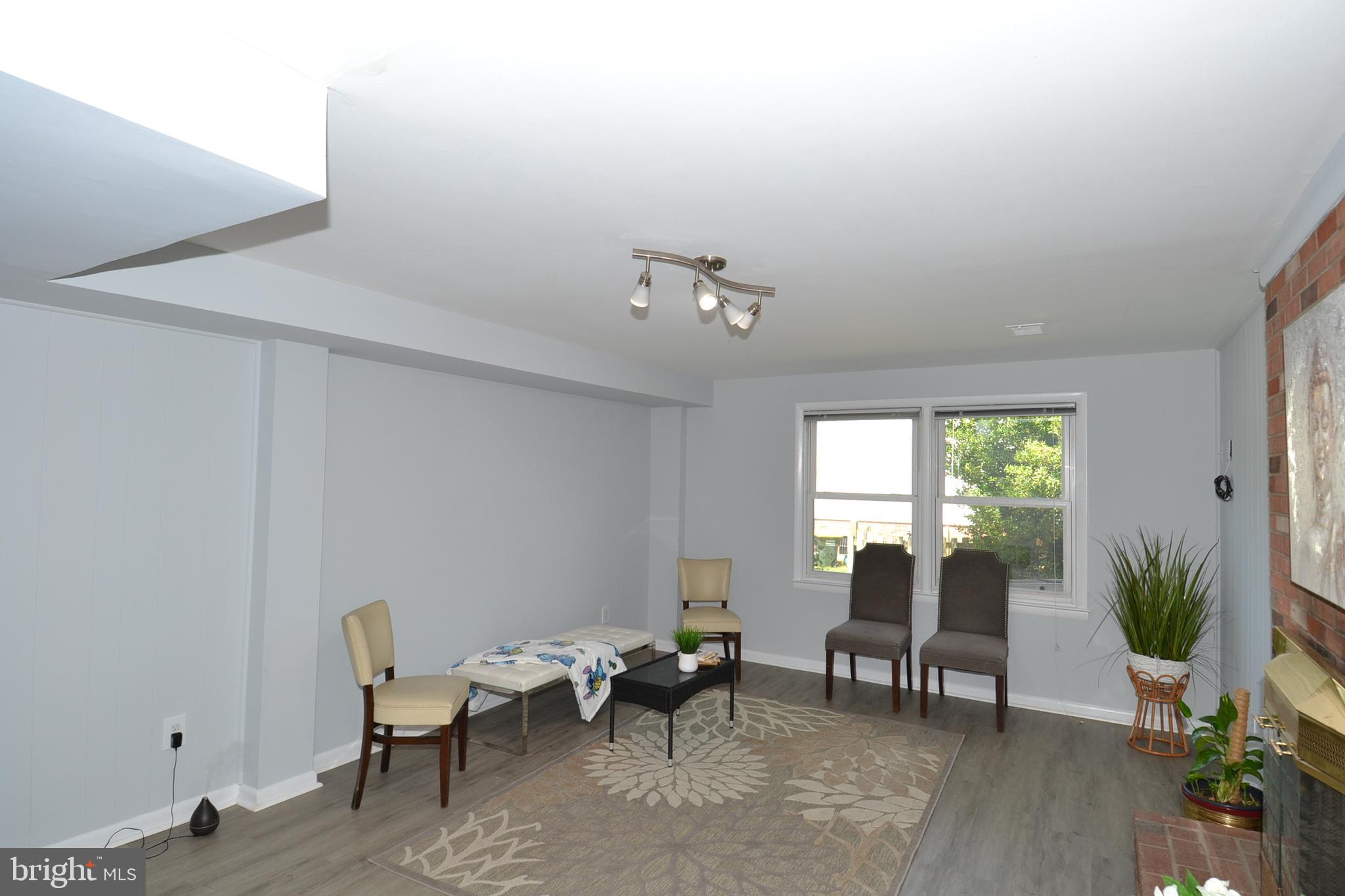 7103 Galgate Drive Springfield, VA 22152 - Photo 28 of 47 a living room with furniture and wooden floor