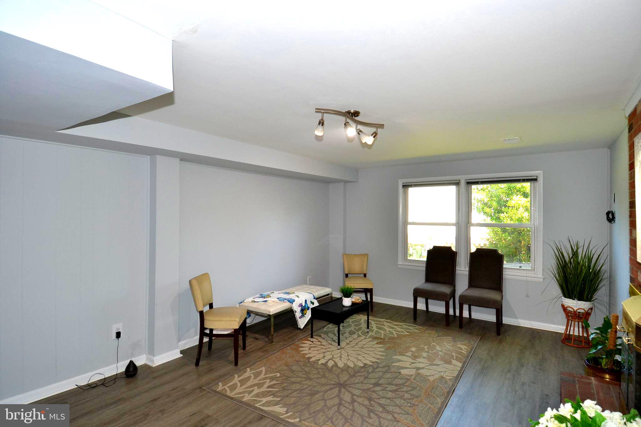 7103 Galgate Drive Springfield, VA 22152 - Photo 29 of 47 a living room with furniture and a large window