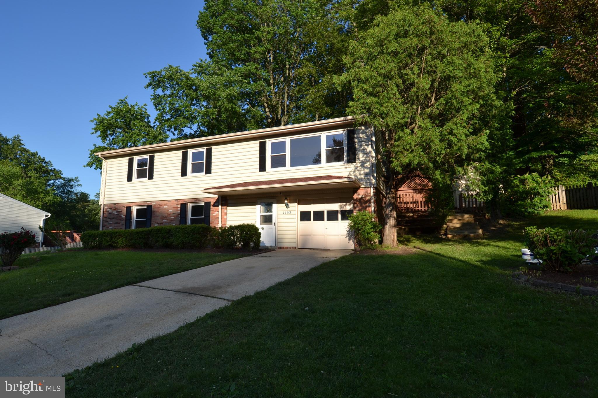 7103 Galgate Drive Springfield, VA 22152 - Photo 3 of 47 a front view of a house with a garden