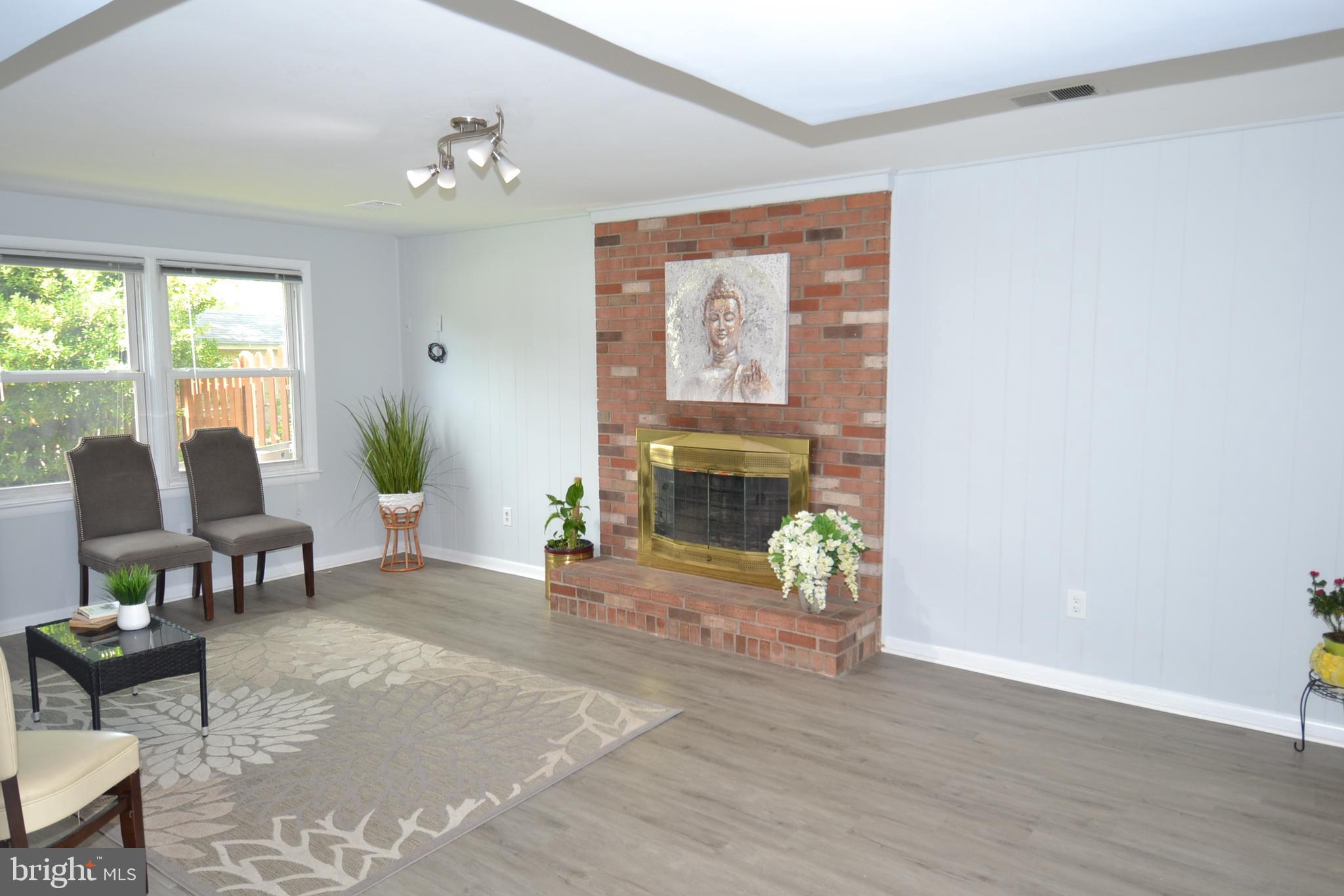 7103 Galgate Drive Springfield, VA 22152 - Photo 34 of 47 a living room with furniture and a table