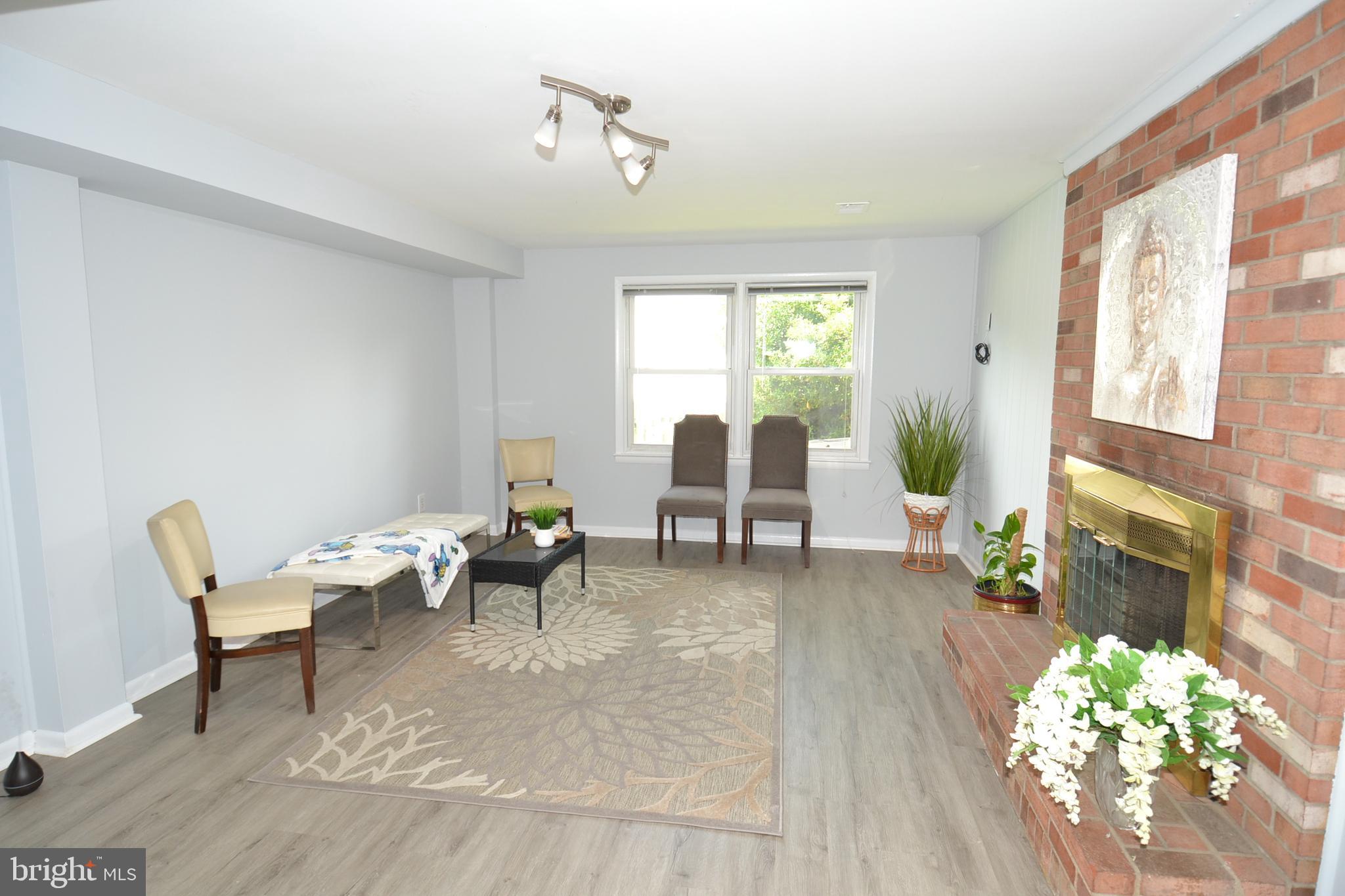 7103 Galgate Drive Springfield, VA 22152 - Photo 39 of 47 a living room with furniture and a large window