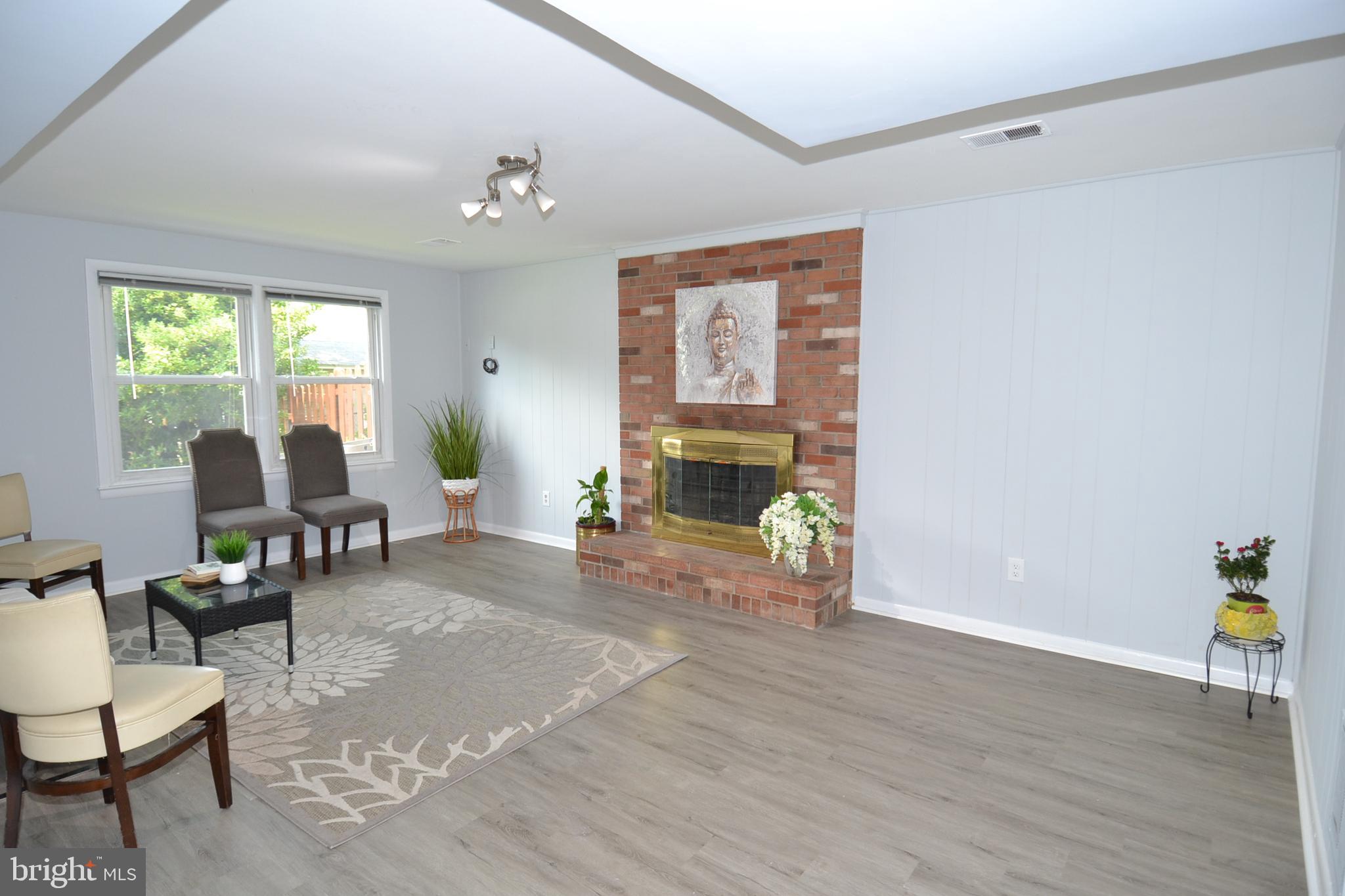 7103 Galgate Drive Springfield, VA 22152 - Photo 40 of 47 a living room with furniture and a fireplace