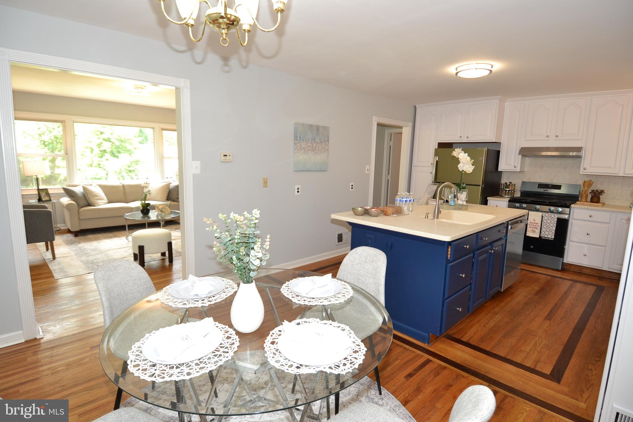 7103 Galgate Drive Springfield, VA 22152 - Photo 4 of 47 a large kitchen with a table and chairs