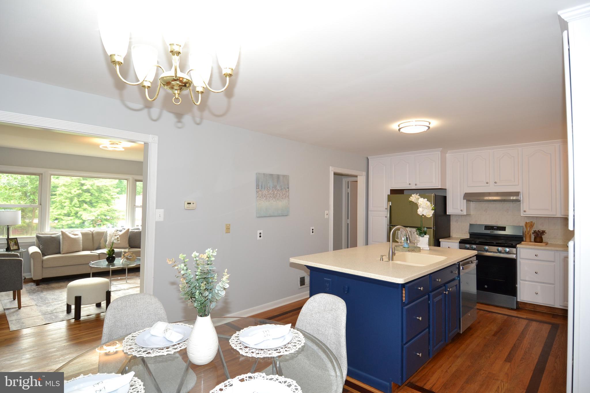 7103 Galgate Drive Springfield, VA 22152 - Photo 5 of 47 a kitchen with a table chairs stove and kitchen view