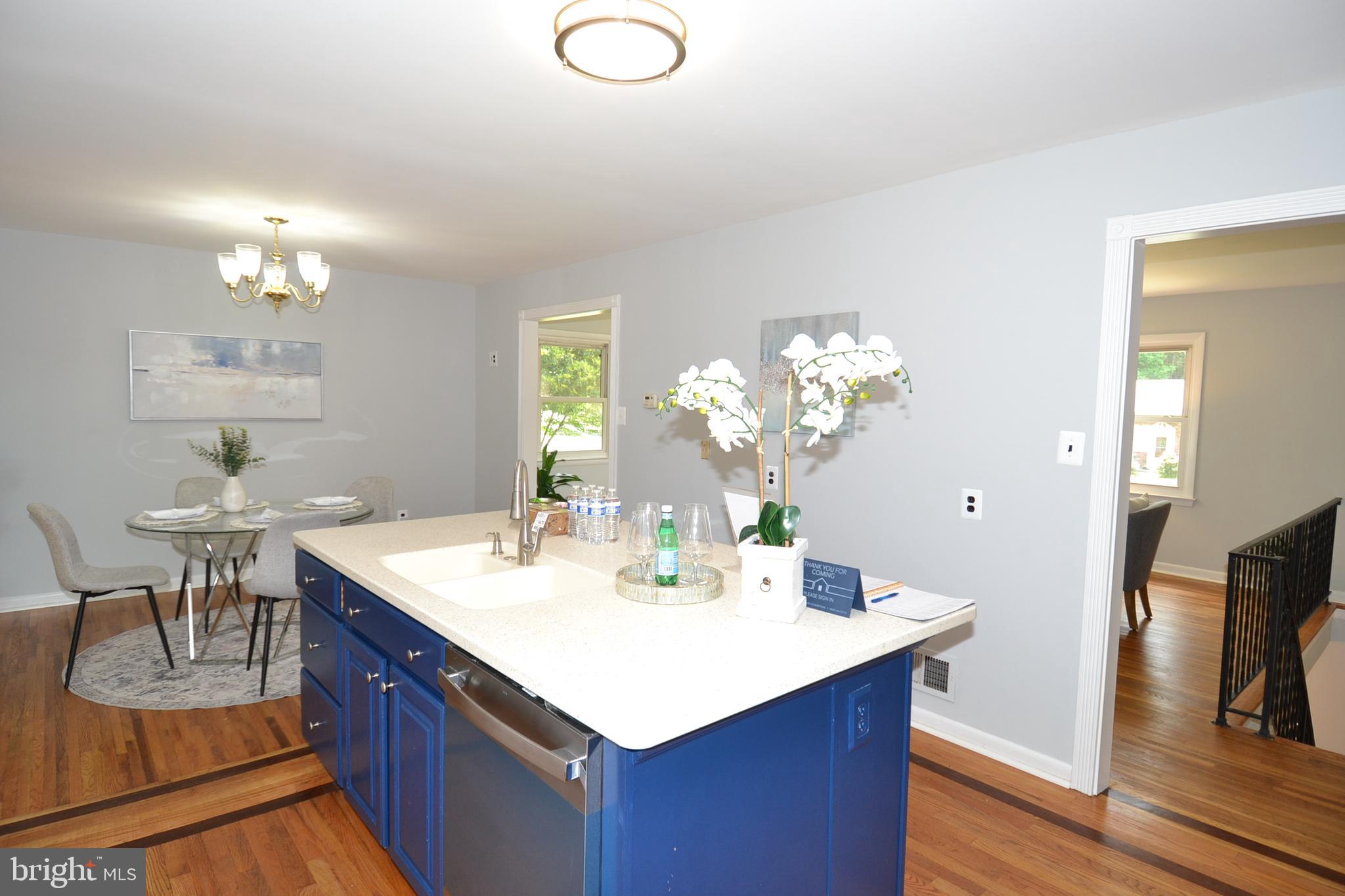 7103 Galgate Drive Springfield, VA 22152 - Photo 9 of 47 a kitchen with a table and chairs