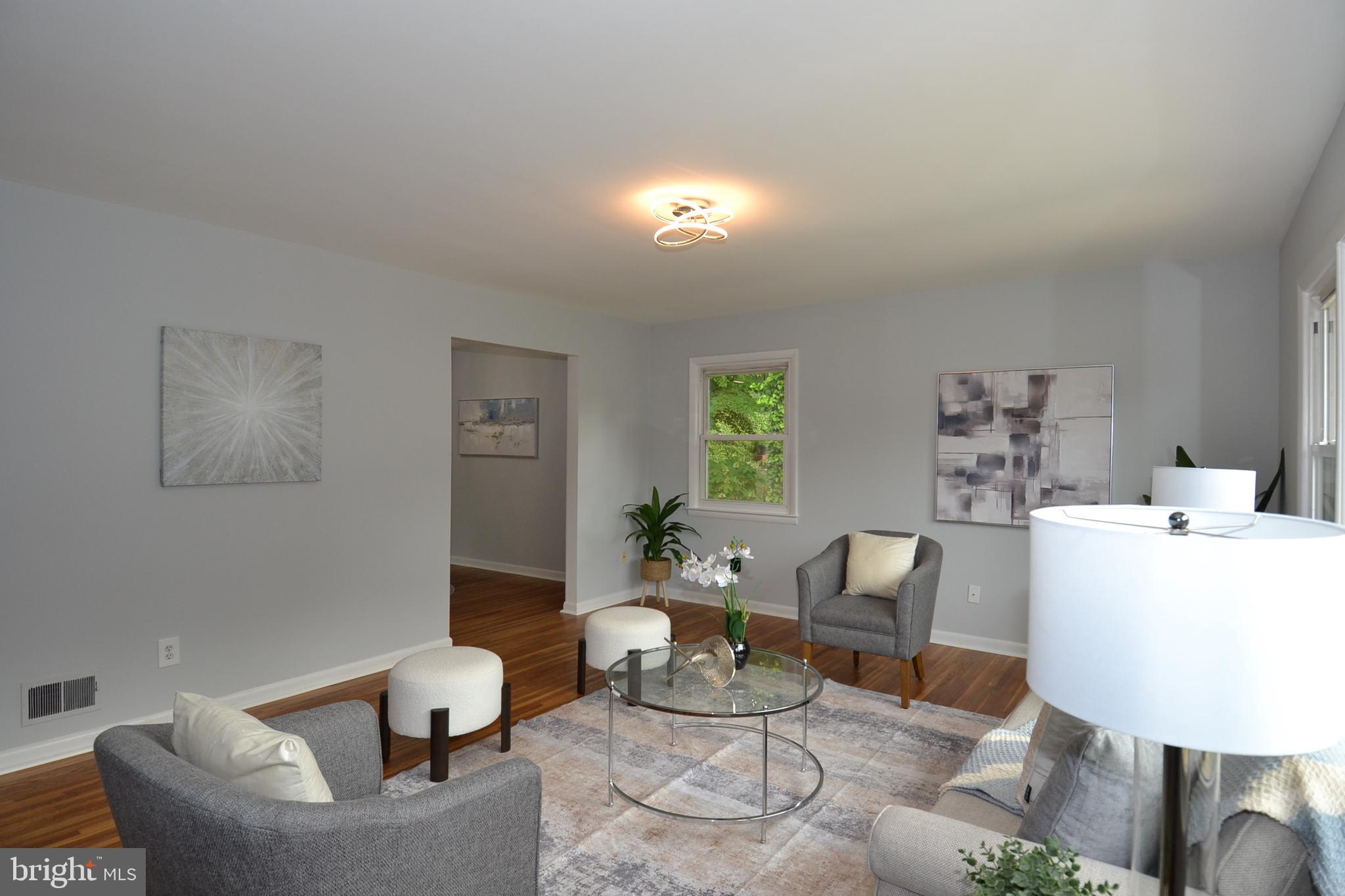 7103 Galgate Drive Springfield, VA 22152 - Photo 10 of 47 a living room with furniture and a potted plant