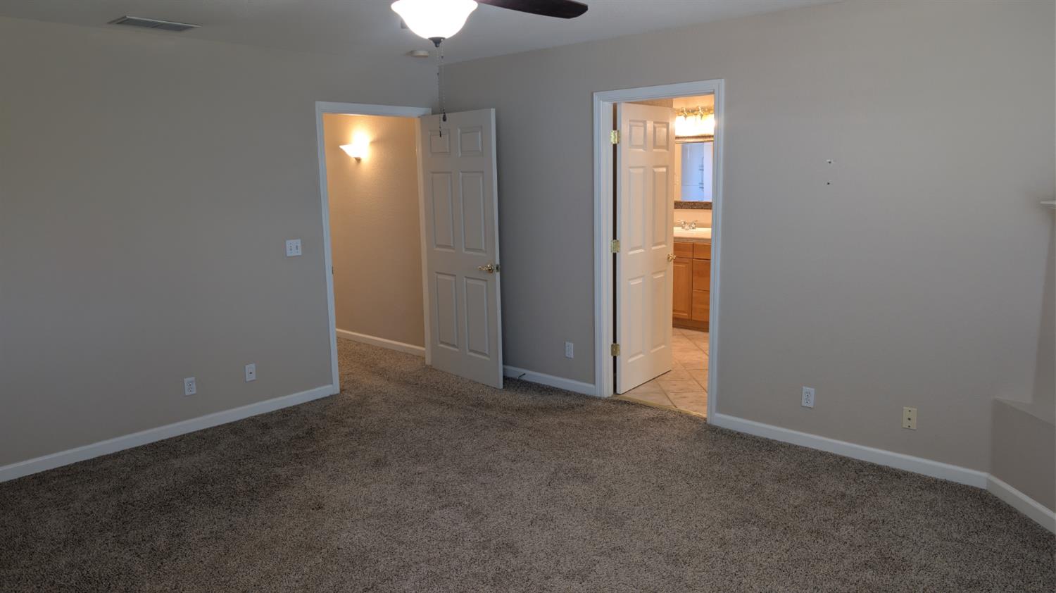 3248 Sudbury Road Cameron Park, CA 95682 - Photo 17 of 41 an empty room with windows and closet