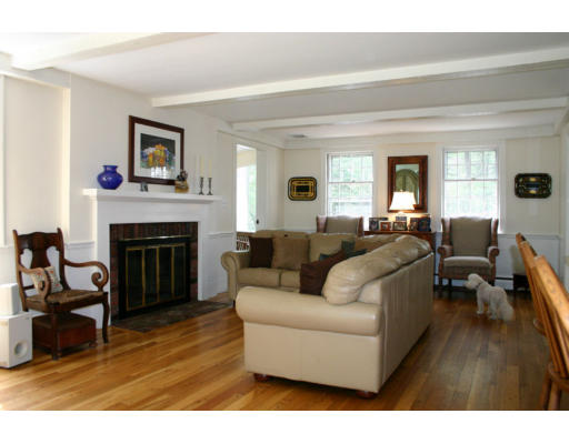 53 Draper Road Wayland, MA 01778 - Photo 8 of 18 a living room with furniture and a fireplace
