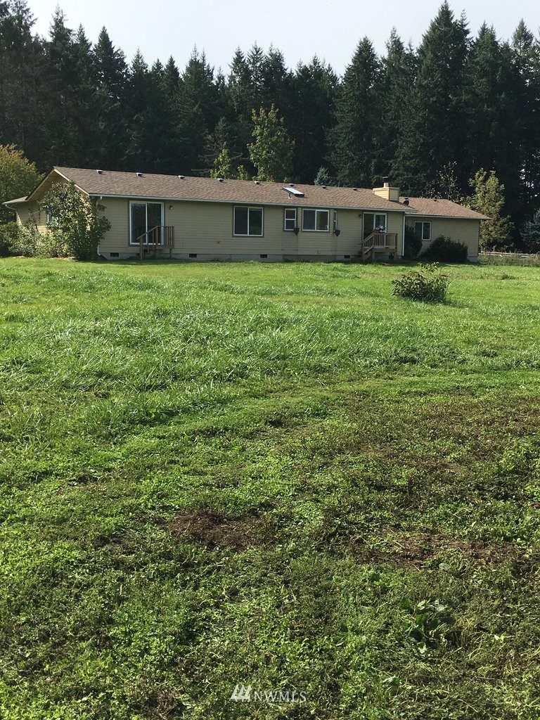 896 King Road Winlock, WA 98596 - Photo 29 of 39 a view of a house with a yard balcony and sitting area