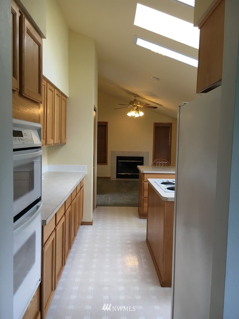 896 King Road Winlock, WA 98596 - Photo 4 of 39 a kitchen with stainless steel appliances a refrigerator and a stove