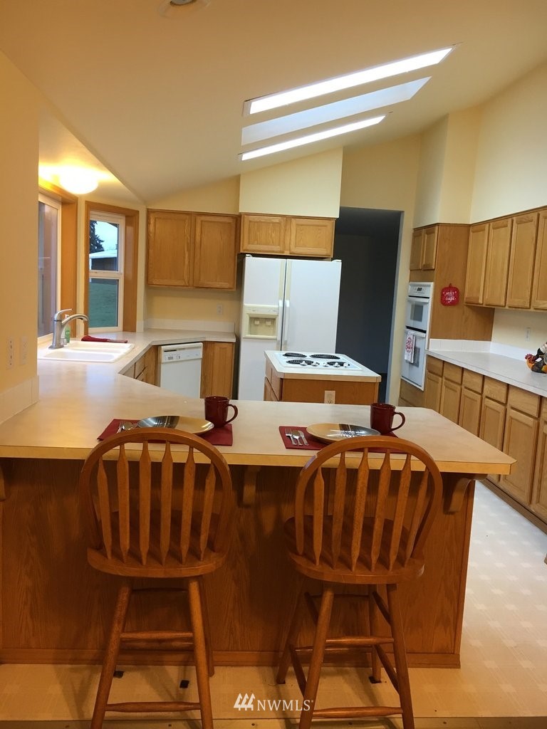 896 King Road Winlock, WA 98596 - Photo 5 of 39 a view of a dining room with furniture and wooden floor