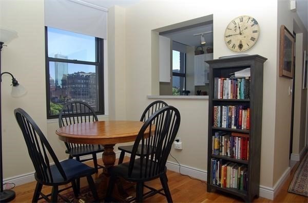 4 Charlesgate East, Unit 602 Boston, MA 02215 - Photo 5 of 24 a view of a dining room with furniture and a window
