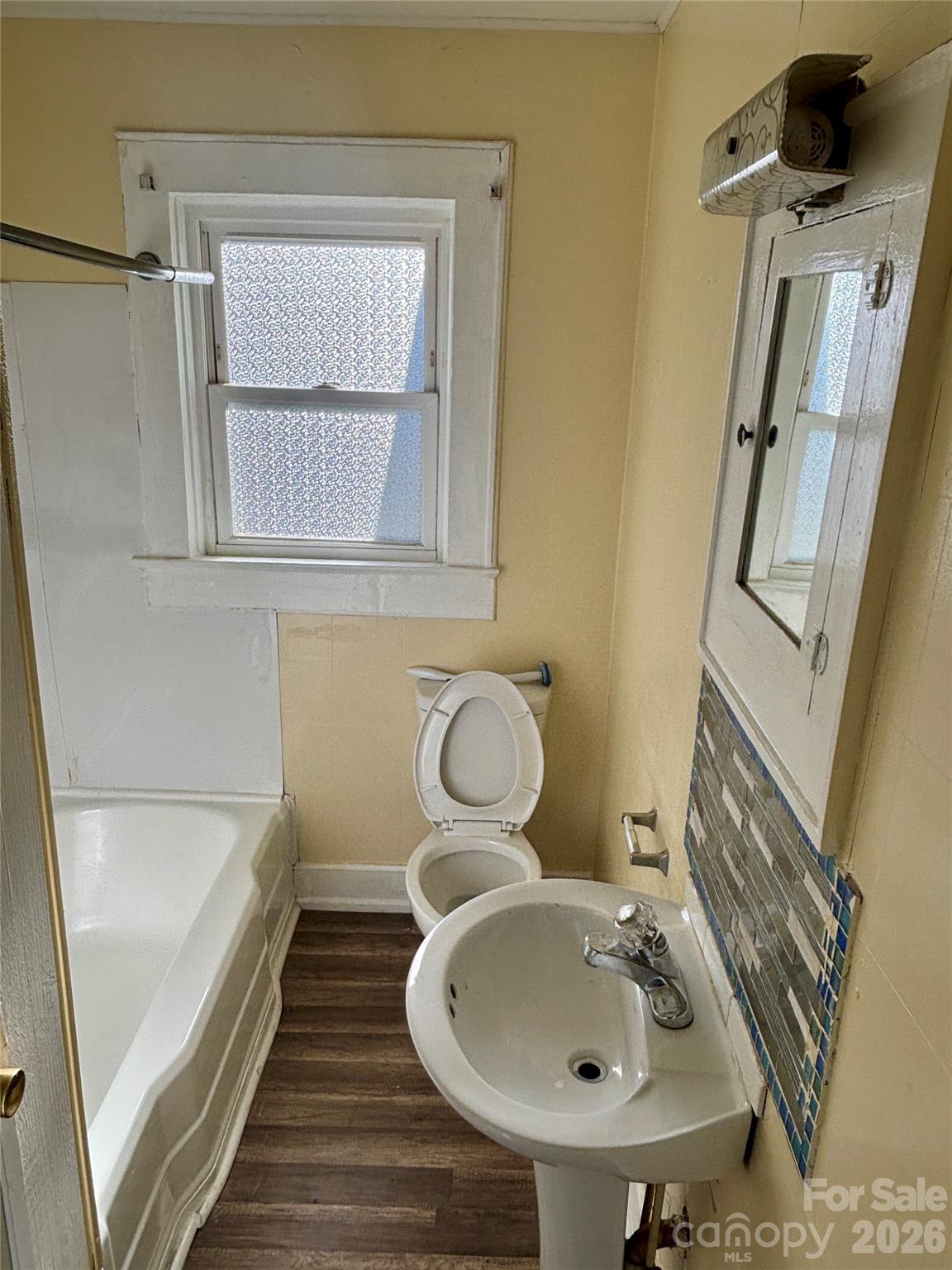2145 14th Avenue Southwest Hickory, NC 28602 - Photo 11 of 17 a bathroom with a sink and mirror with toilet