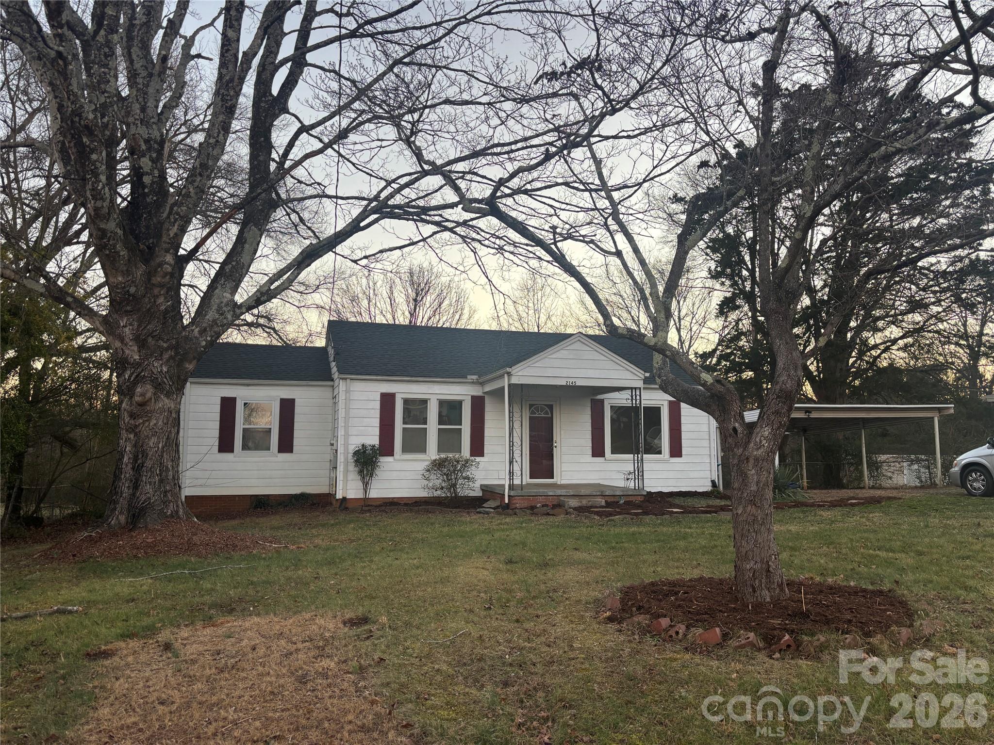 2145 14th Avenue Southwest Hickory, NC 28602 - Photo 15 of 17 a front view of a house with garden