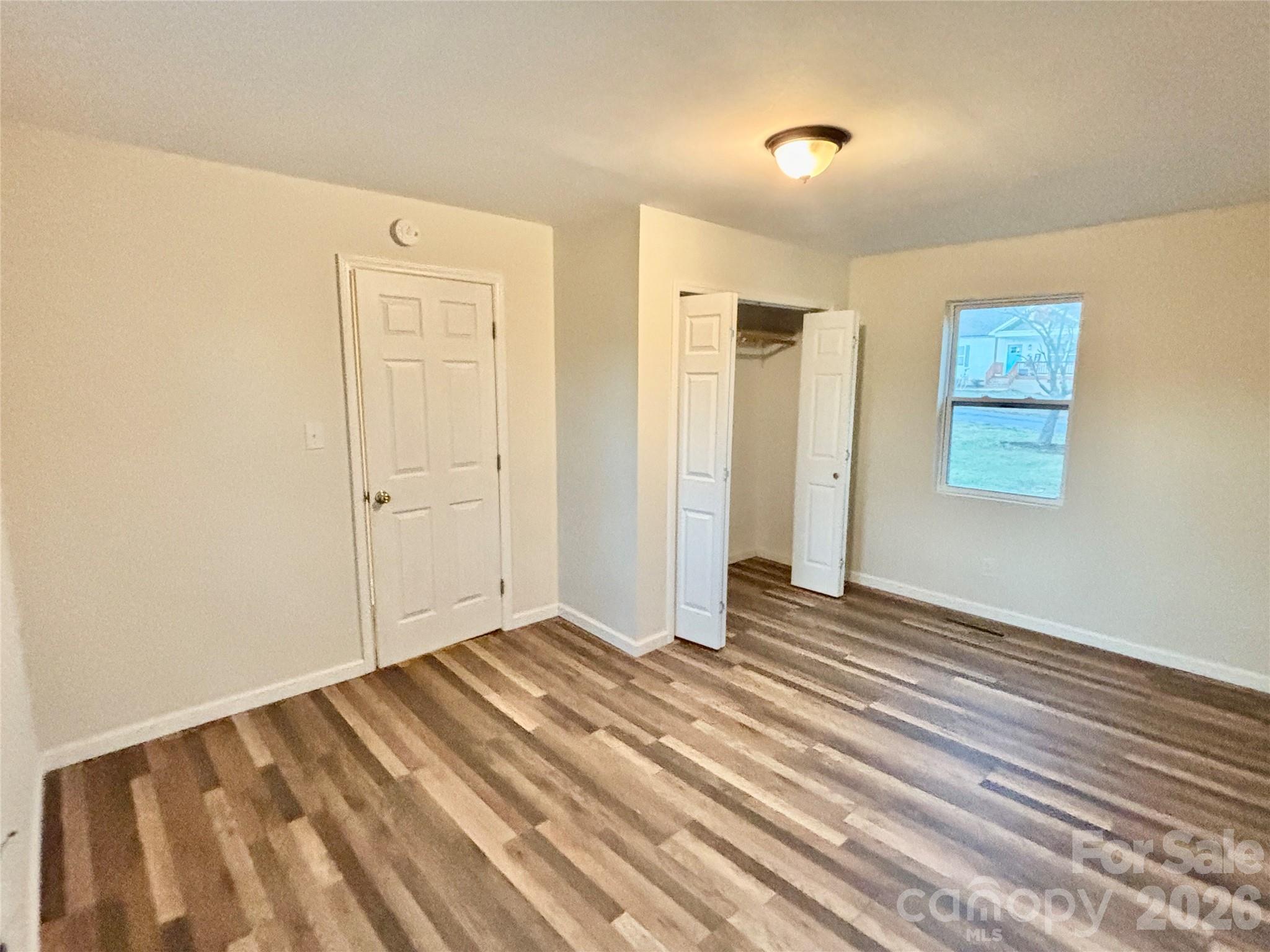 2145 14th Avenue Southwest Hickory, NC 28602 - Photo 9 of 17 a view of an empty room with wooden floor