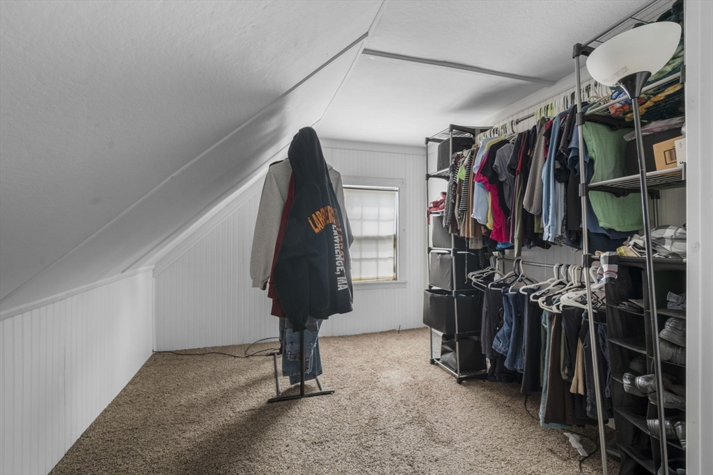 17-19 Whitehall Road Amesbury, MA 01913 - Photo 28 of 37 a view of walk in closet with clothes and shoes