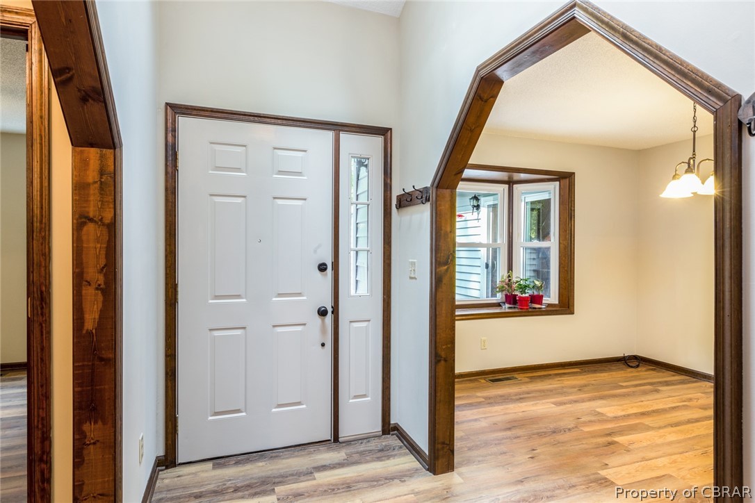 A view into the dining room with bay window.