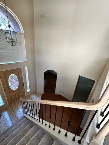 a view of swimming pool with table and chairs