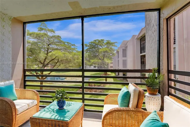 a view of living room with furniture and a window
