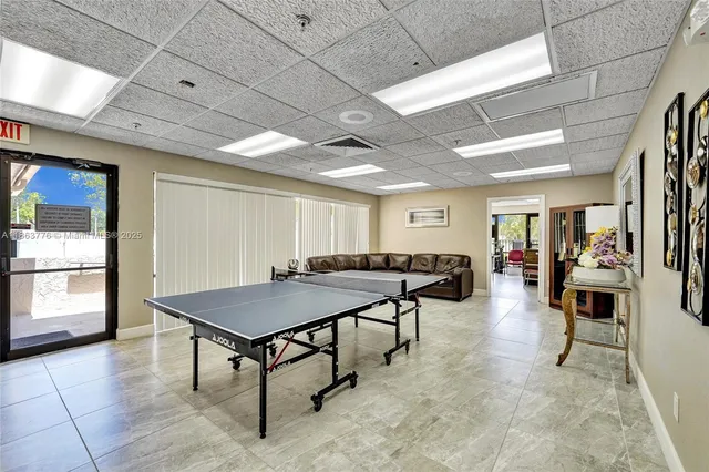 a living room with lots of furniture and a table