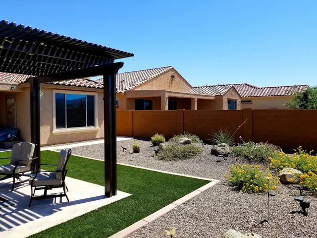 a view of a chairs and tables in patio