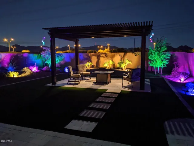 a view of a grassy field with an ocean