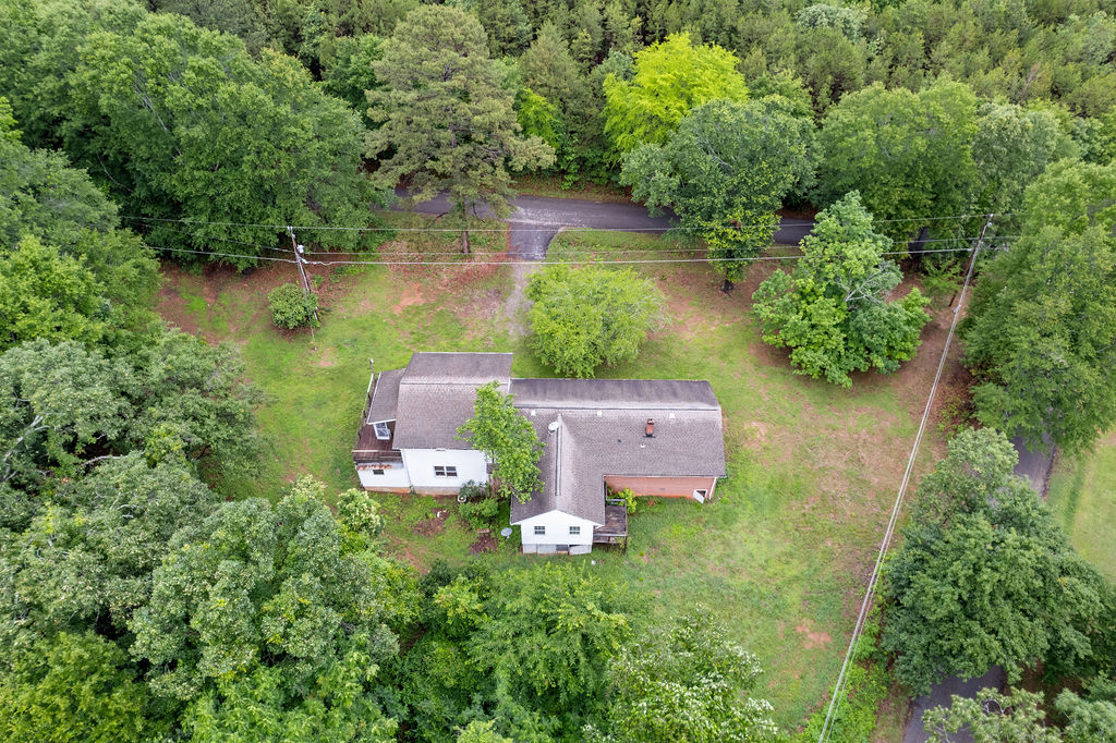 712 Whitney Way Anderson, SC 29625 - Photo 3 of 31 An aerial perspective reveals a secluded residence embraced by a verdant, mature treeline.