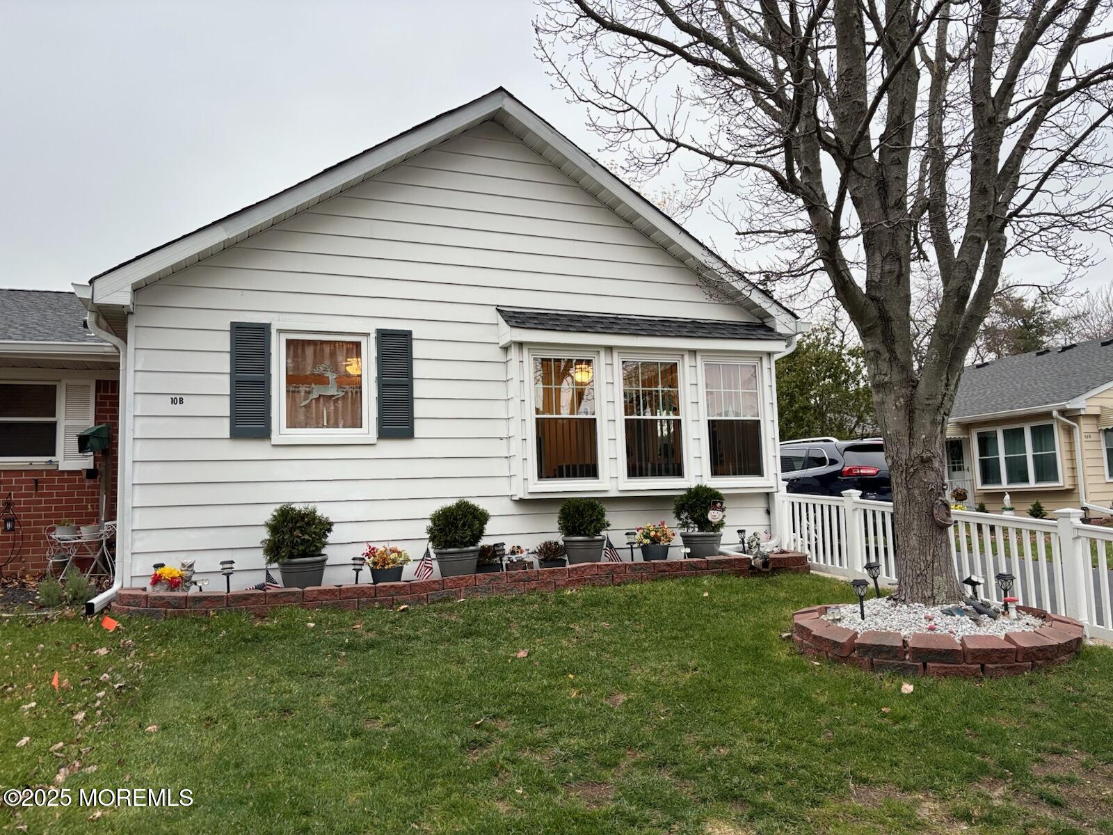 10 Constitution Boulevard, Unit B Whiting, NJ 08759 - Photo 14 of 57 a front view of house with yard and green space